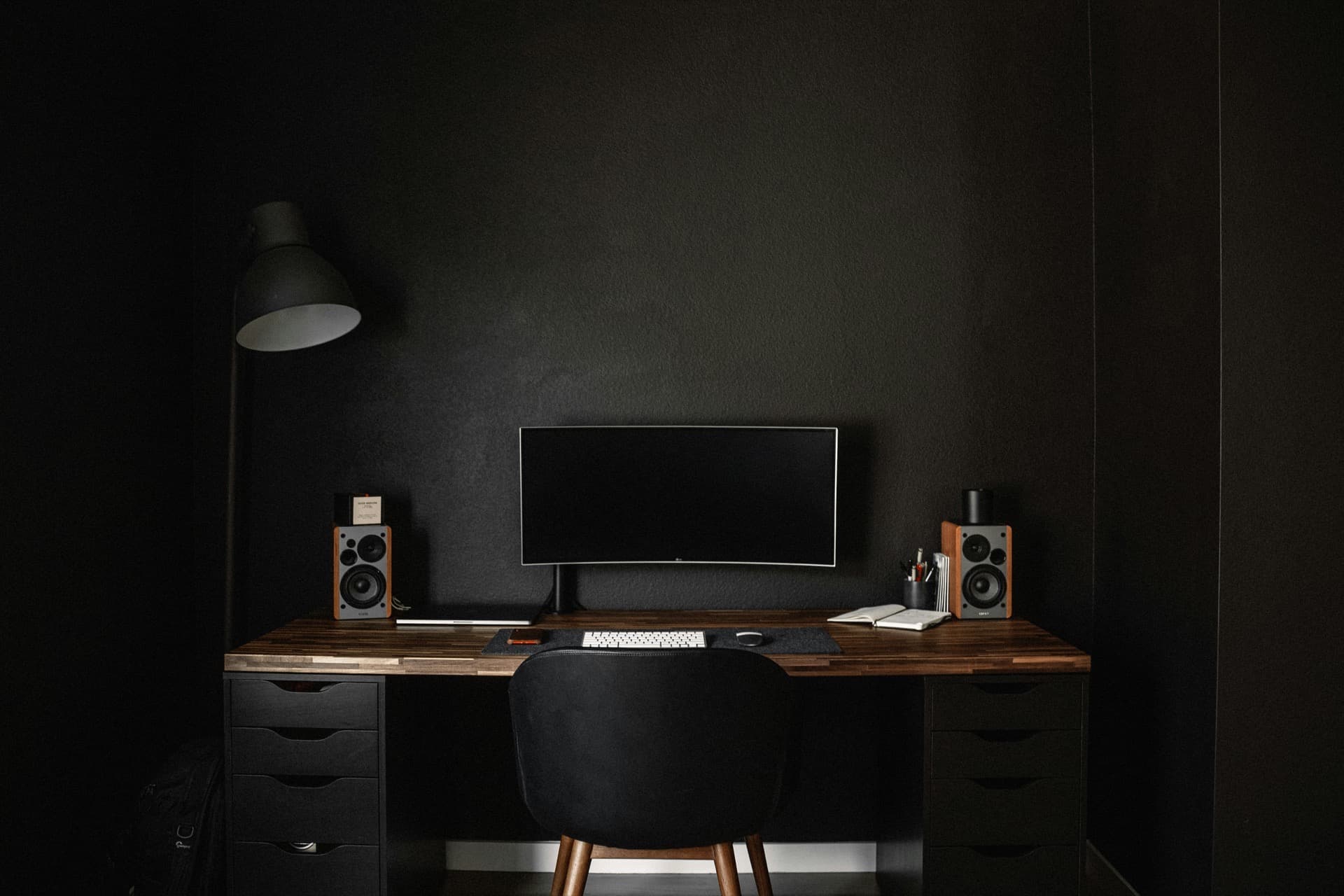 Minimalist desk in a warm, dark atmosphere
